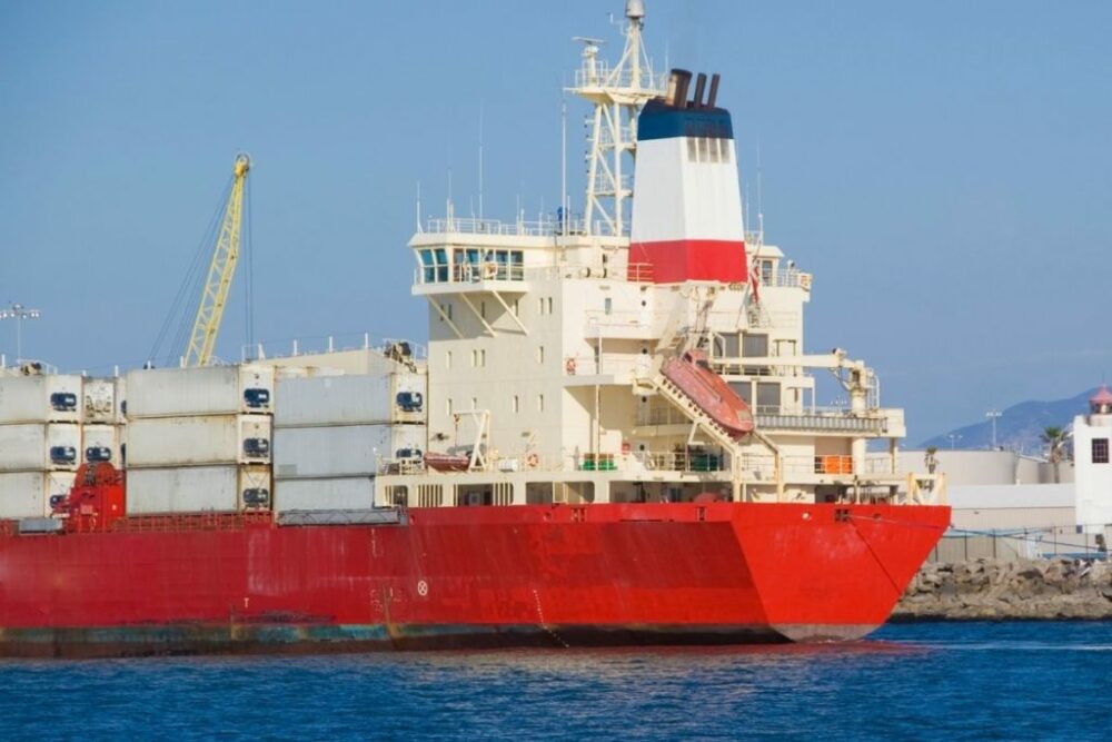 The Stern Of A Container Ship berthed in port.