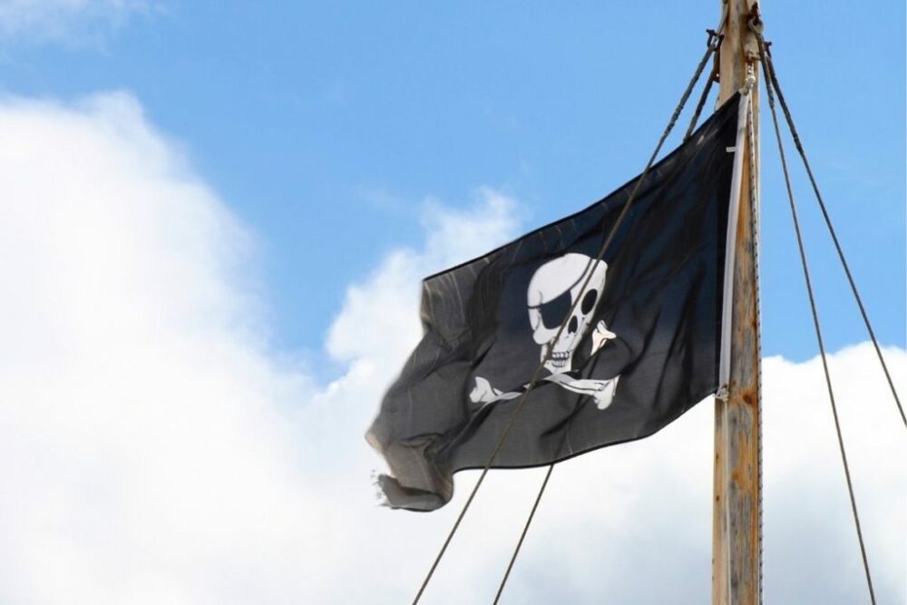 The widely recognized symbol of piracy at sea - The Jolly Roger, or Skull-and-Crossbones flag.