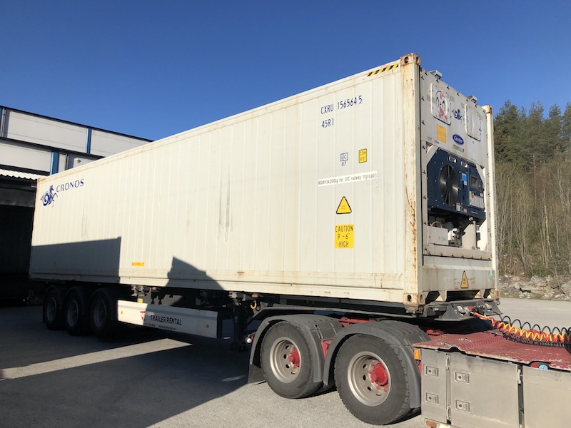 40’ High cube reefer container on a trailer at the loading terminal.