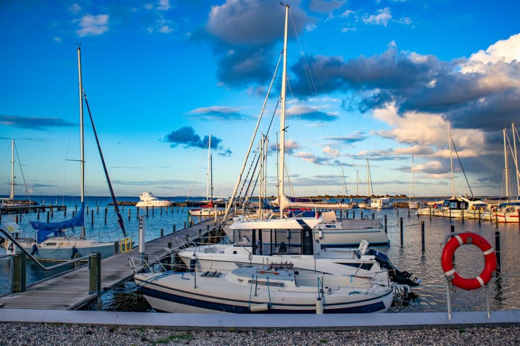 marine forecast to be checked before sailing in open sea. Marina with sailboats looks calm, but the weather can get changed in few hours.