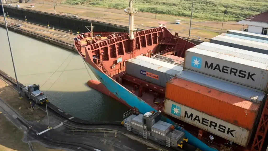 How Much Does a Cargo Ship Weigh? Very large container vessel passing the locks in Panama Canal