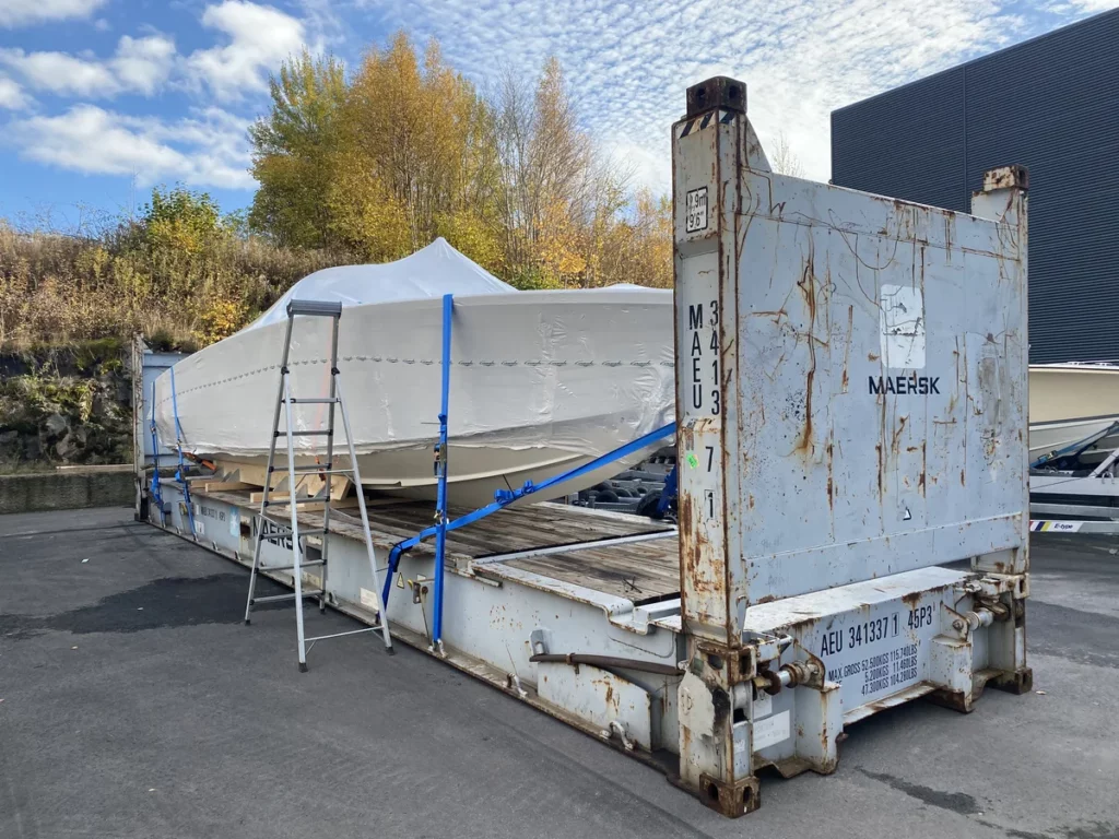 Boat Transportation on Flat Rack in plastic wrap