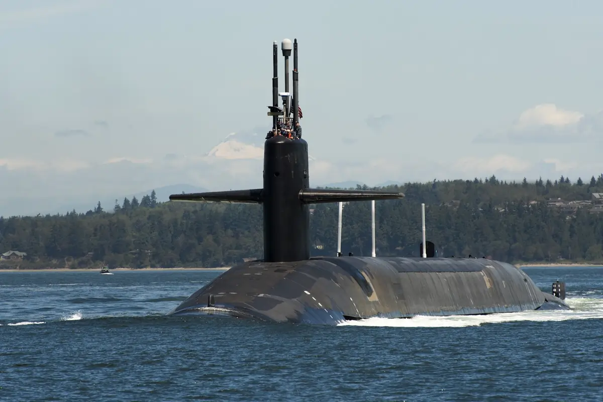 How do submarines communicate with shore-based facilities