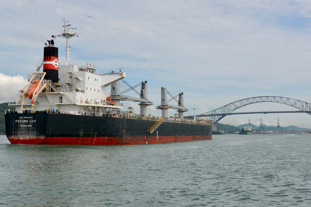 Ultramax bulk carrier underway entering us port with pilot ladder ready for pilot boarding