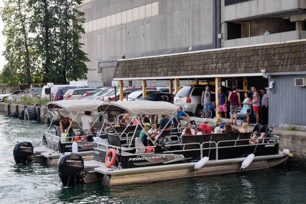 party pontoon boat for 20 guests docking at pier 