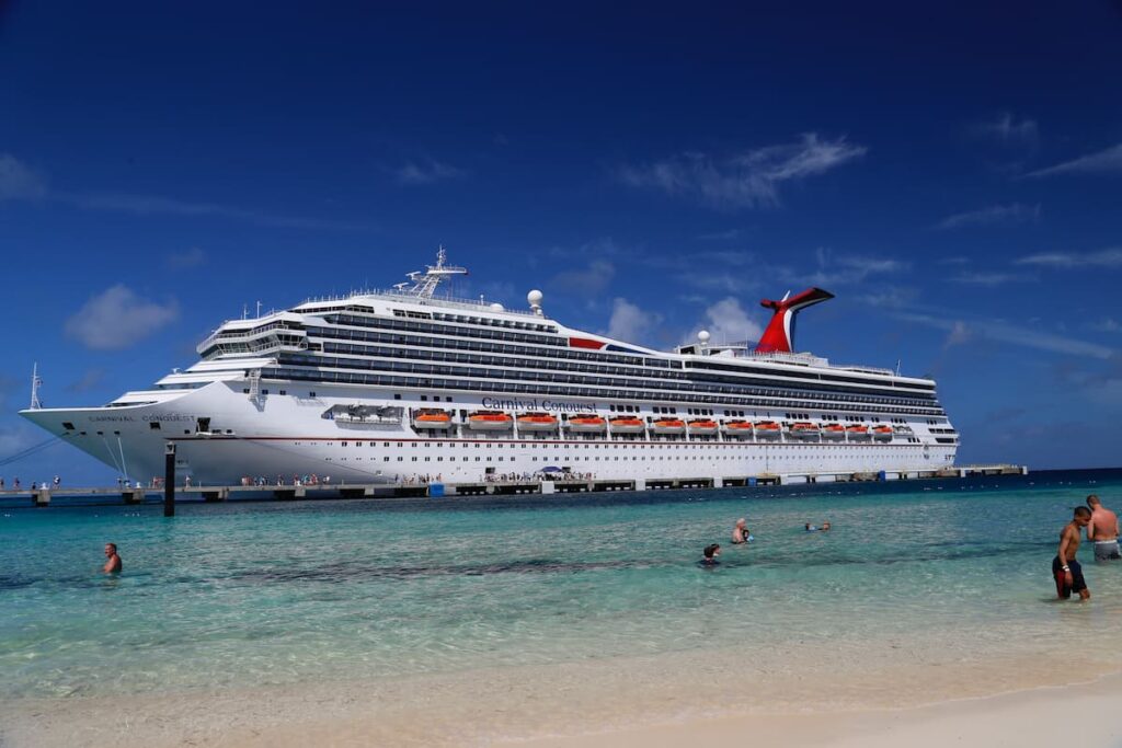 A Cruise Ship Carnival Conquest Seen from a Beach