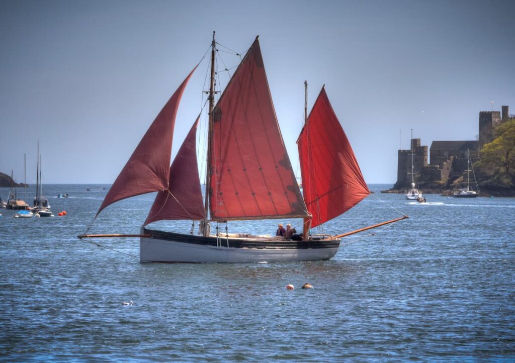 Full set of tanbark sails rigged on sailingboat