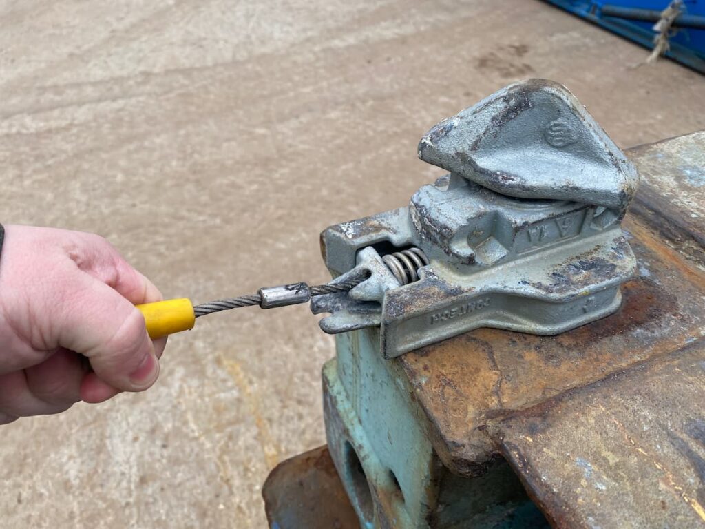 Applying Twist Locks for stacking shipping containers