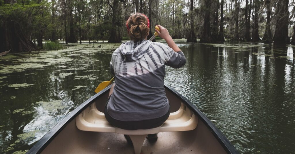 A woman on a canoe